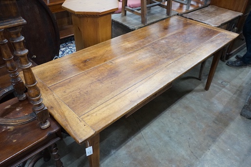 An early 19th century French rectangular fruitwood kitchen table fitted two drawers, length 201cm, depth 80cm, height 76cm